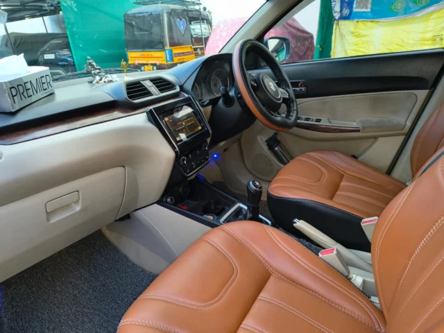 Dzire cab front seat interior with leather covers
